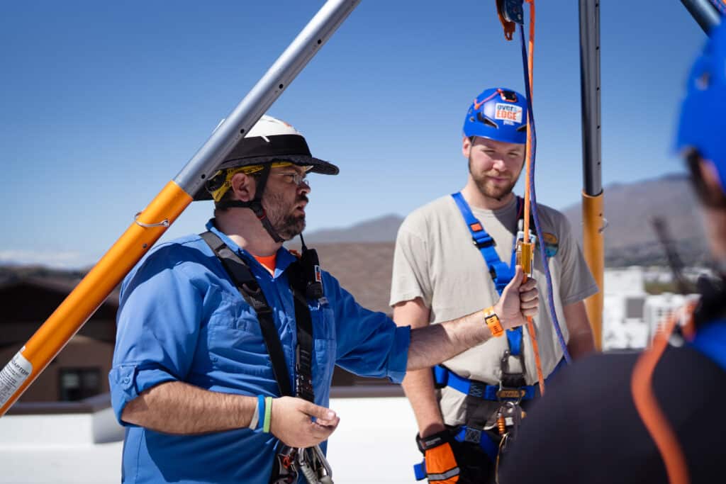 Two male adults at CDCAC'S Over the Edge Event