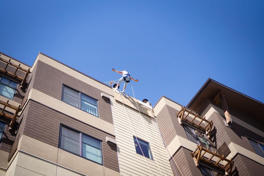 Participant rappelling down the Residence Inn Building during the 2025 CDCAC Over the Edge fundraiser