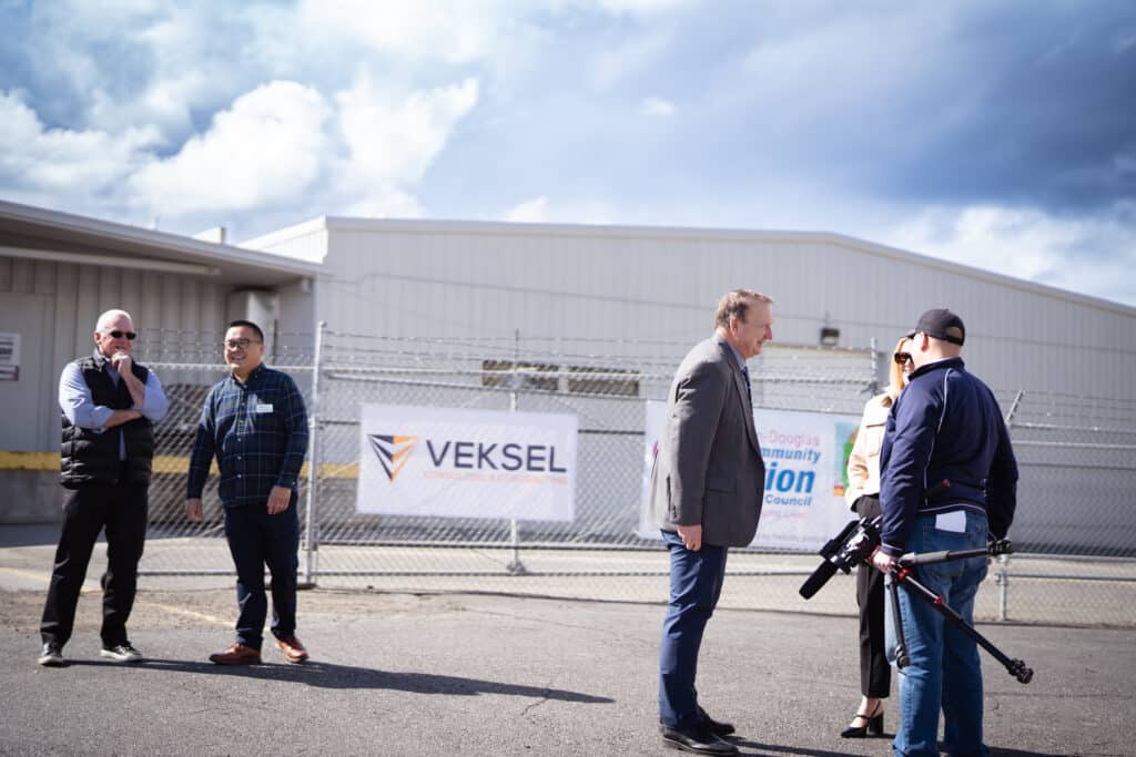 Two groups of adults happily conversating