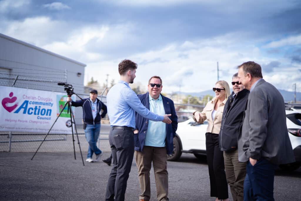 A group of 5 adults introducing themselves to each other at the CDCAC's Food Pantry