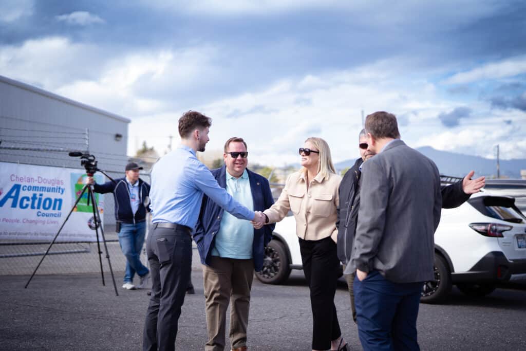 A group of 5 adults introducing themselves to each other at the CDCAC's Food Pantry