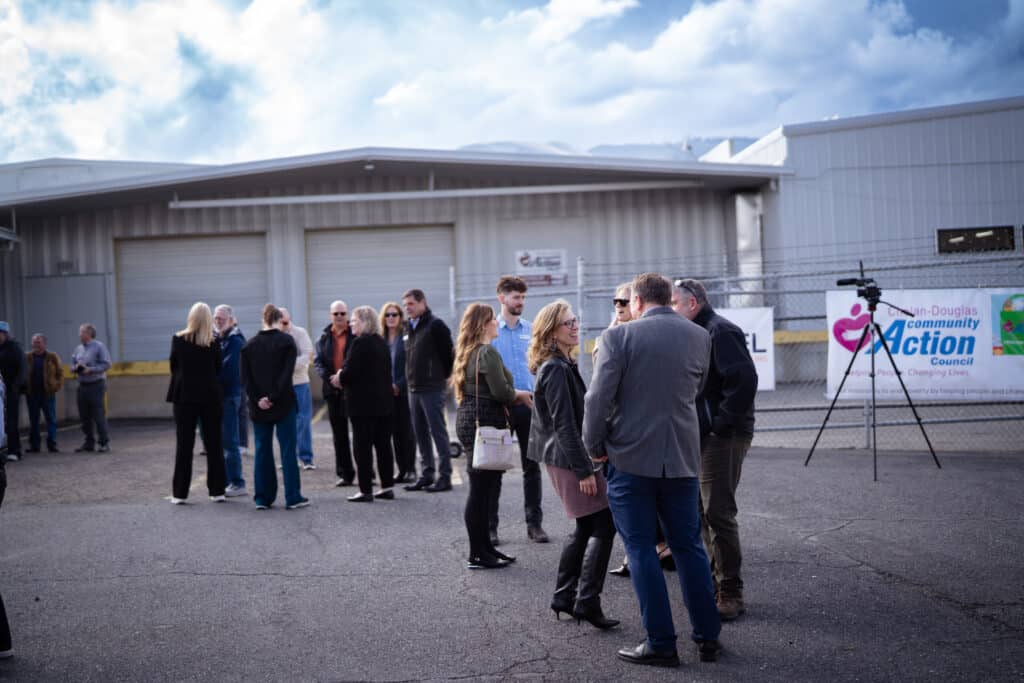 A group of multiple adults conversating at CDCAC's Food Pantry