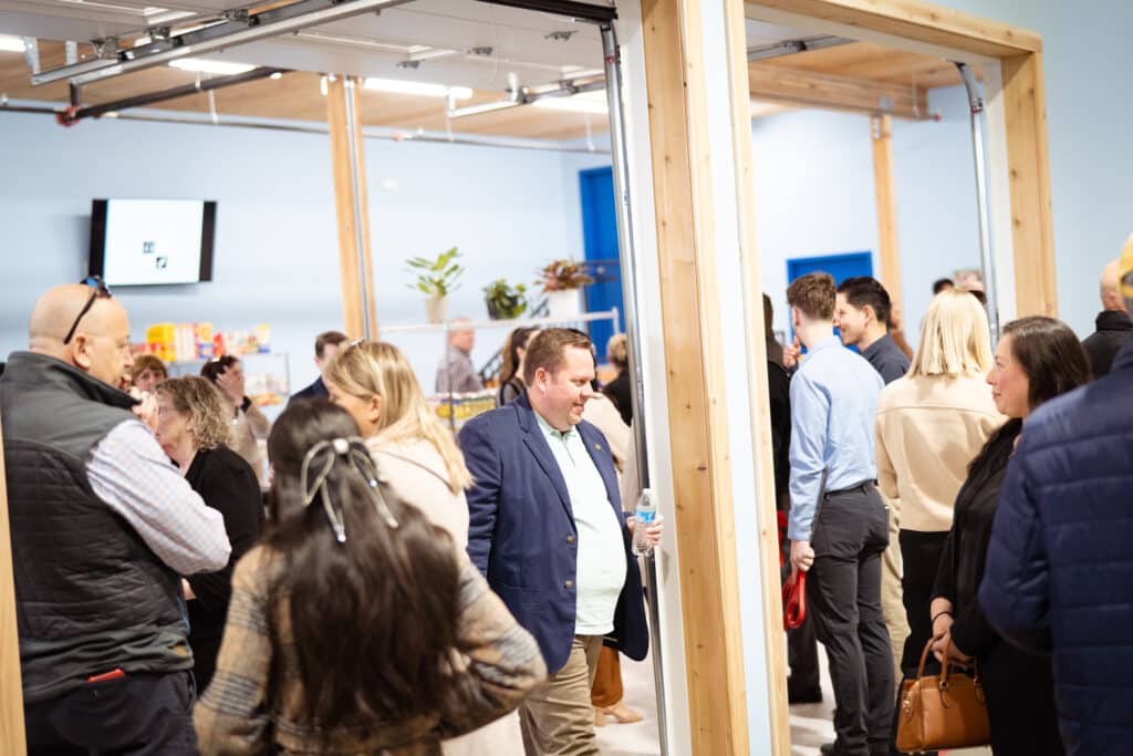 A group of adults joined together at CDCAC'S Food Pantry Event