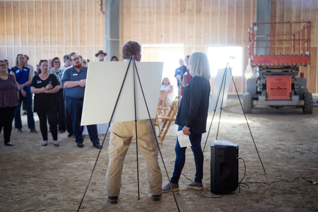 The backside of two presenters at Alatheia Therapeutic Riding Center