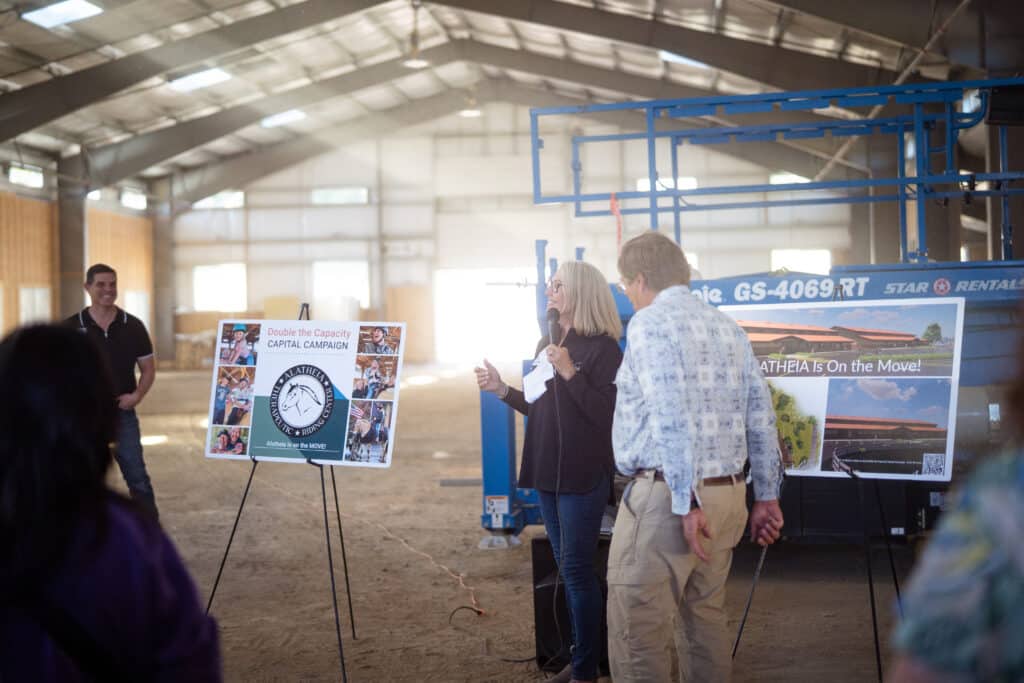 A male and female presenter at Alatheia Therapeutic Riding Center