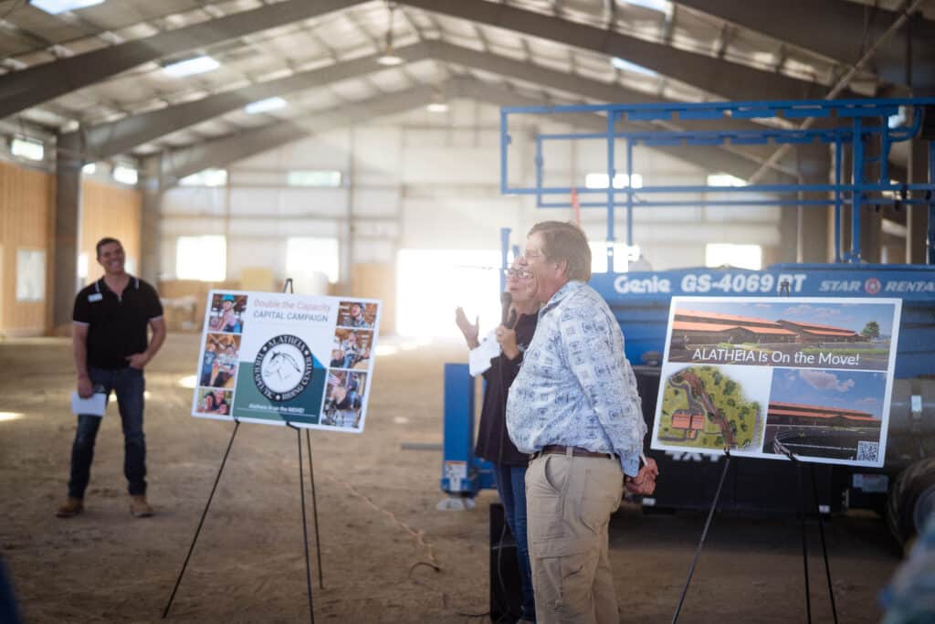 A male and female presenter at Alatheia Therapeutic Riding Center