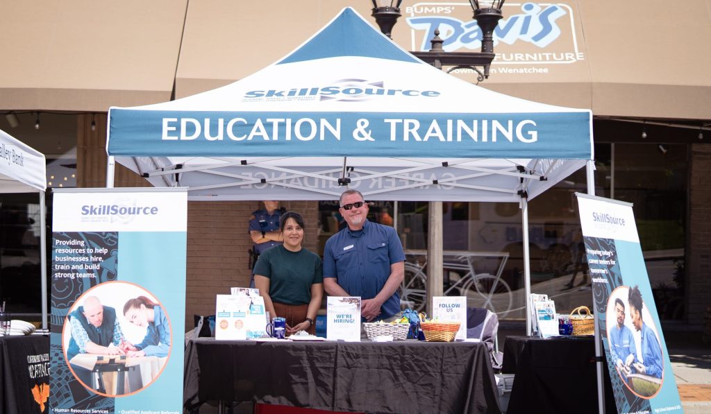 LaTerraza2024-01 2 members of SkillSource staff at an outdoor booth